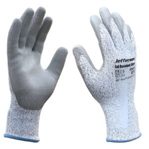 The Cut Resistant Gloves Extra Large - JEFGLCG-XL are grey and white, feature textured palms and safety markings, and are perfect for demanding tasks or tool hire Newry services.