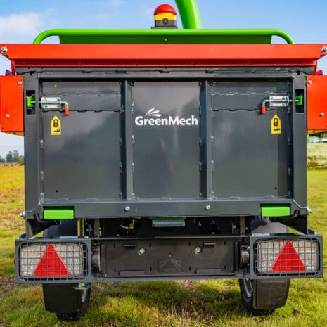 Arborist 150 6″ Road Towed Wood Chipper-3 Rear view of the Arborist 150 6″ Road Towed Wood Chipper on grass, showing warning labels, red reflectors, and safety features—perfect for anyone looking for tool hire in Newry.