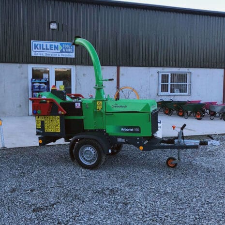 Arborist 150 6″ Road Towed Wood Chipper-4 An Arborist 150 6″ Road Towed Wood Chipper in green is parked outside Killen Tool & Hire, a popular tool hire spot in Newry, with several wheelbarrows lined up nearby.