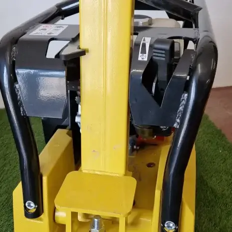 Cargo PB60 5.5hp Vibrating Whacker Plate-2 Close-up of the Cargo PB60 5.5hp Vibrating Wacker Plate with metal handles and wheels on artificial grass—ideal for tool hire Newry projects.