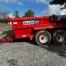 A red Tuff Mac DT14 Dump Trailer with “KILLEN Tools & Hire” branding, a trusted tool hire name in Newry, is parked on gravel outdoors under a partly cloudy sky.
