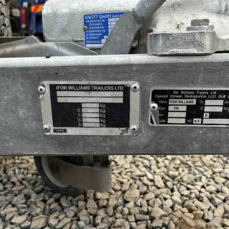 IFor Williams Plant Trailer-6 Close-up of two metal identification plates on an Ifor Williams Plant Trailer, displaying weight specs and serial info against a gravel background—perfect for those looking to hire tools in Newry.