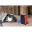 The Sealey 70L Industrial Dehumidifier SDH70, available at tool hire Newry, is placed on a tiled floor beside a blue bucket and covered equipment in a partially renovated room with exposed brick walls.